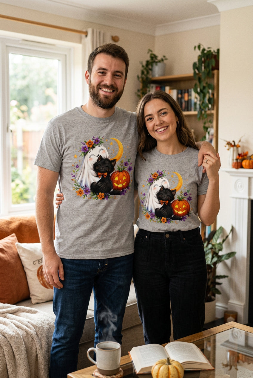 Ghost Hugging Cat Pumpkin Halloween t-shirt — ash Gildan G200 Ultra Cotton tee with a happy little ghost hugging a black cat wearing a dapper orange bow tie, a glowing jack-o-lantern, a crescent moon, and a ring of fall flowers