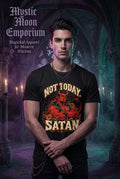 A black short-sleeve crewneck t-shirt featuring a graphic print of a red devil with crossed arms, surrounded by the text 'NOT TODAY SATAN' in a distressed cream font, set against a plain white background.