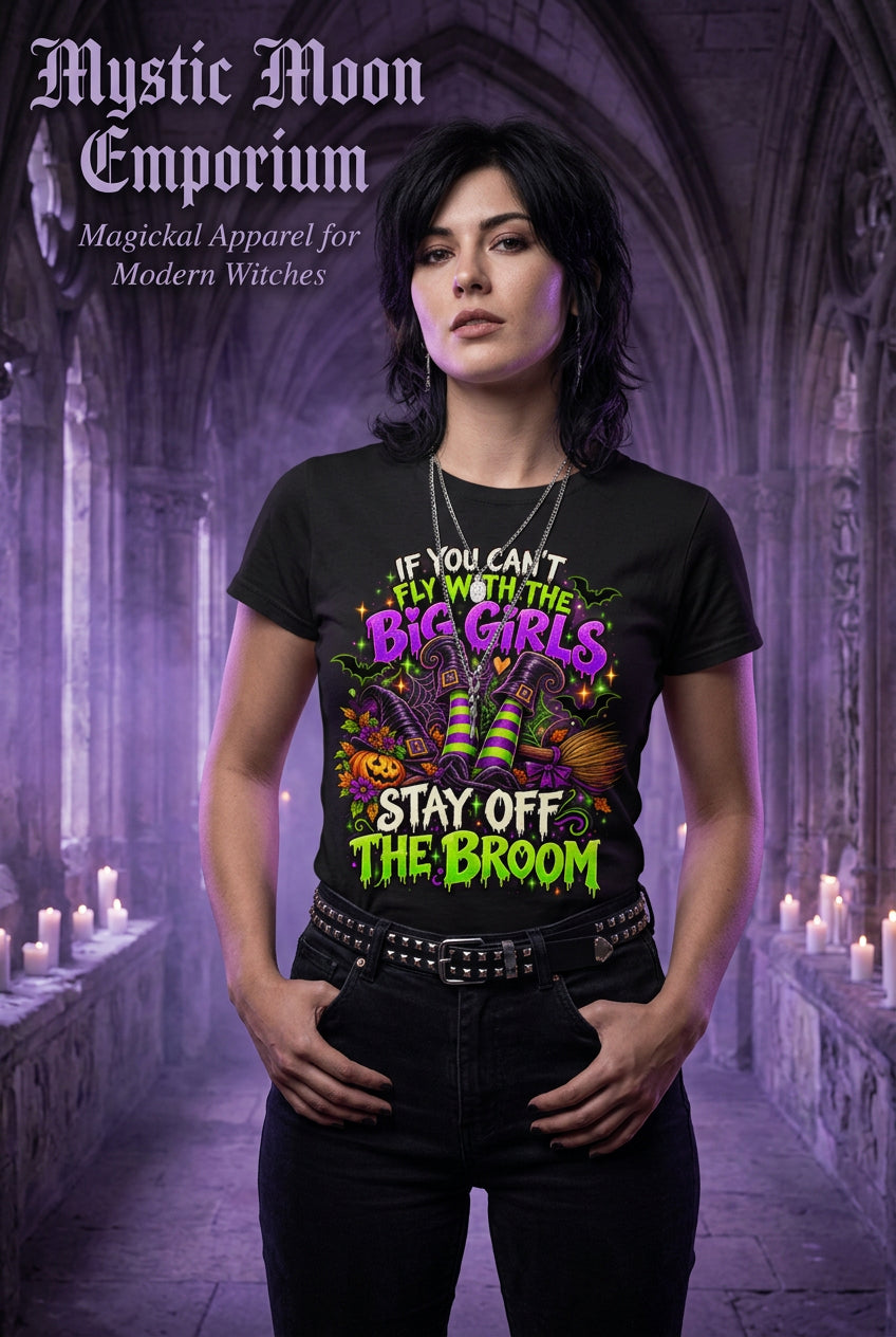 If You Can't Fly With The Big Girls Stay Off The Broom Halloween t-shirt — black Gildan G200 Ultra Cotton tee with a witch flying on a broomstick and bold sassy lettering
